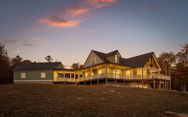 view of back house at dusk