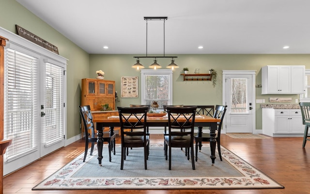 dining space with light wood-type flooring