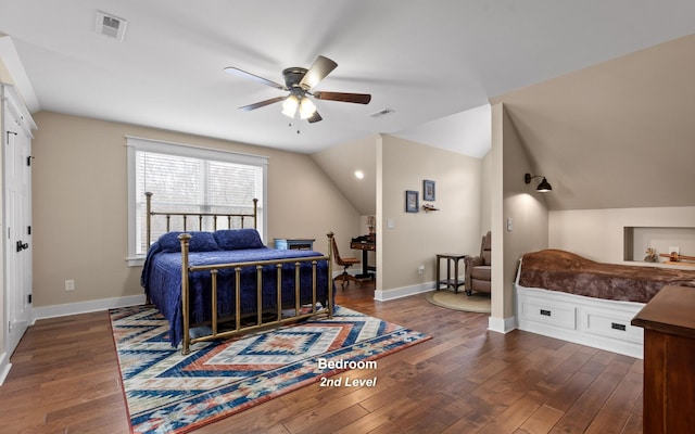 bedroom featuring ceiling fan, dark hardwood / wood-style flooring, and vaulted ceiling