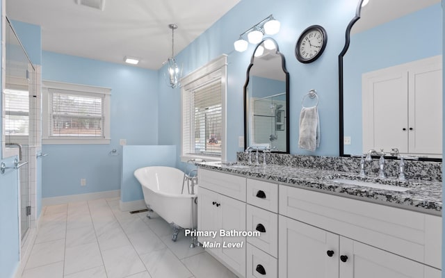 bathroom featuring tile patterned flooring, vanity, a healthy amount of sunlight, and independent shower and bath