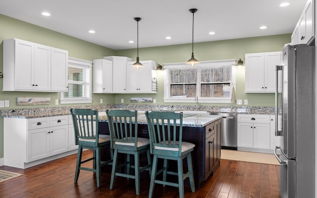 3868 Hobbstown Rd, Dunlap, TN 37327 - kitchen with stainless steel appliances, a center island, white cabinetry, and recessed lighting