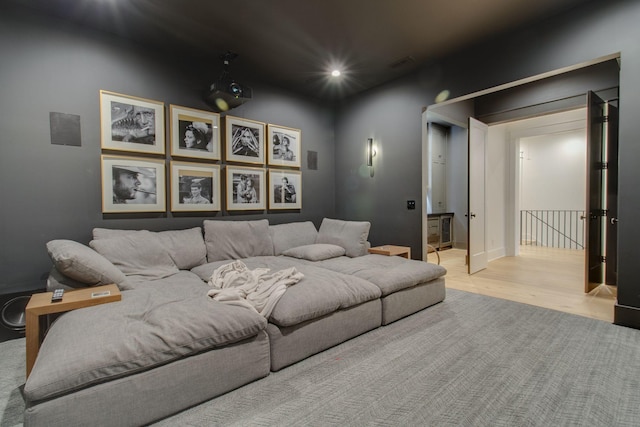 cinema room featuring light hardwood / wood-style floors