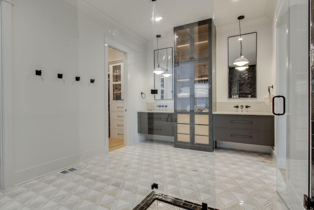 bathroom with vanity and crown molding