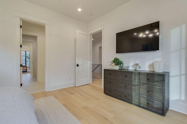 bedroom with light hardwood / wood-style floors