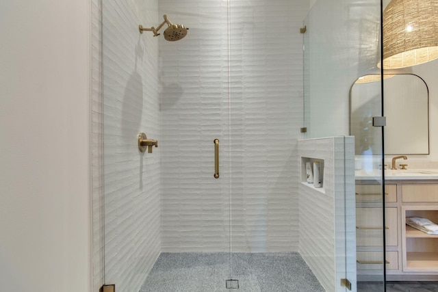 bathroom featuring vanity and an enclosed shower