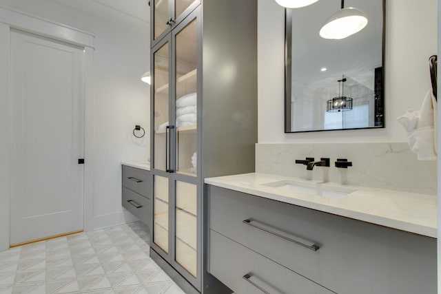 bathroom with vanity and backsplash