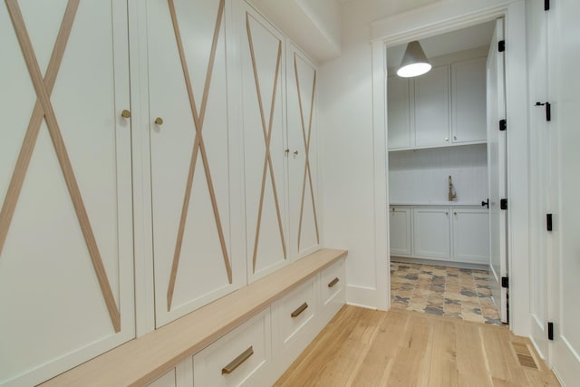 mudroom with light wood-type flooring