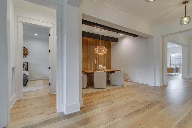 hall featuring light hardwood / wood-style floors and crown molding