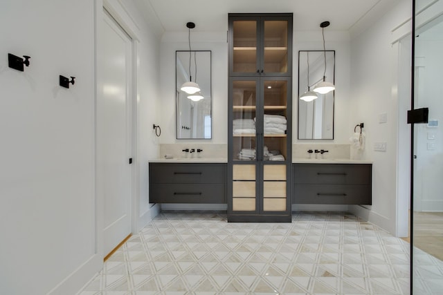 bathroom with vanity and ornamental molding