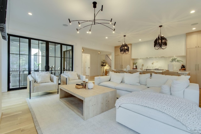 living room featuring french doors and light hardwood / wood-style flooring