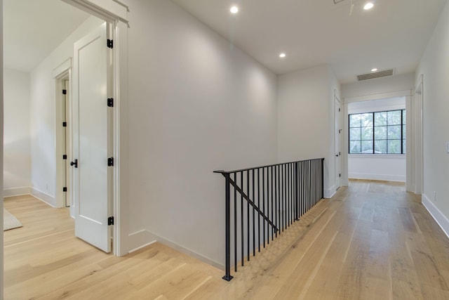 corridor with light wood-type flooring