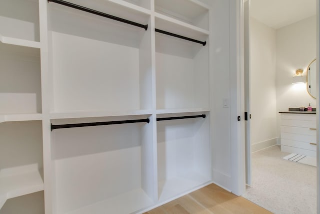 spacious closet featuring light hardwood / wood-style flooring