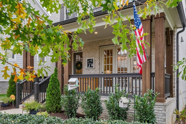 property entrance with covered porch