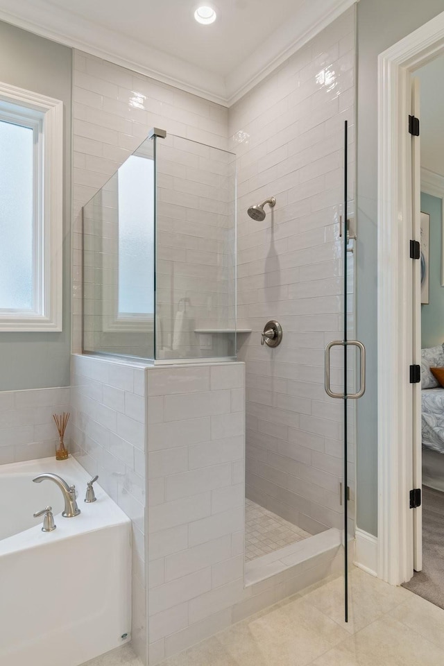 bathroom featuring tile patterned floors, ornamental molding, and plus walk in shower