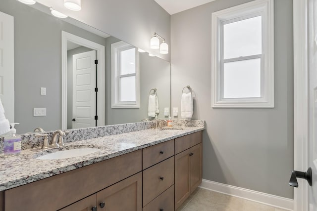 bathroom featuring tile patterned floors and vanity