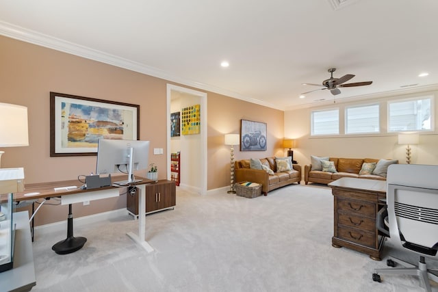 carpeted home office with ceiling fan and crown molding