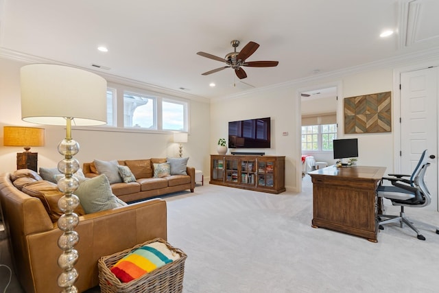 living room featuring crown molding, ceiling fan, and light carpet