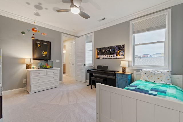 carpeted bedroom with ceiling fan and ornamental molding