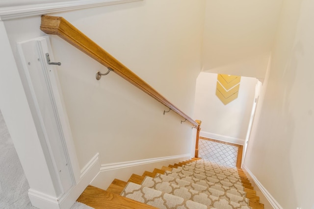 stairs with hardwood / wood-style flooring