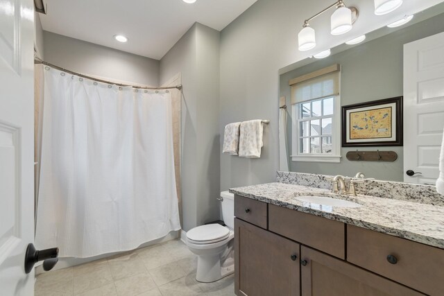 bathroom with tile patterned flooring, vanity, toilet, and a shower with shower curtain