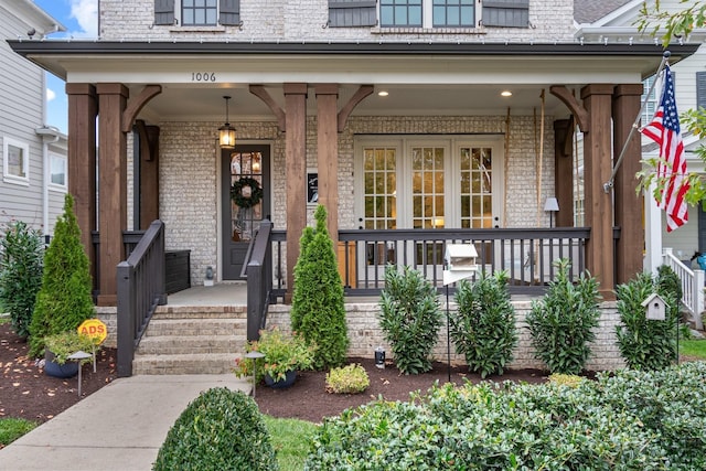 entrance to property featuring a porch