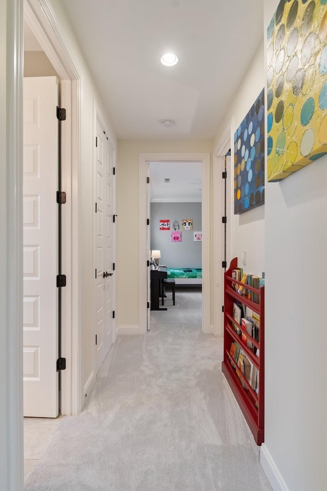 corridor with light colored carpet