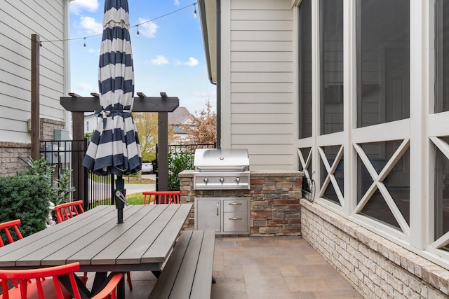 view of patio / terrace featuring area for grilling and exterior kitchen