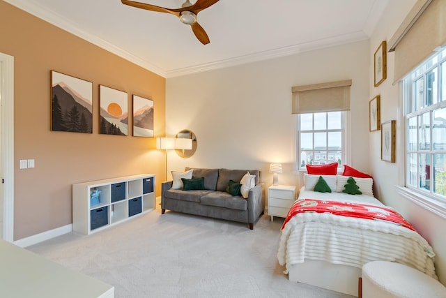 bedroom featuring multiple windows, crown molding, and ceiling fan