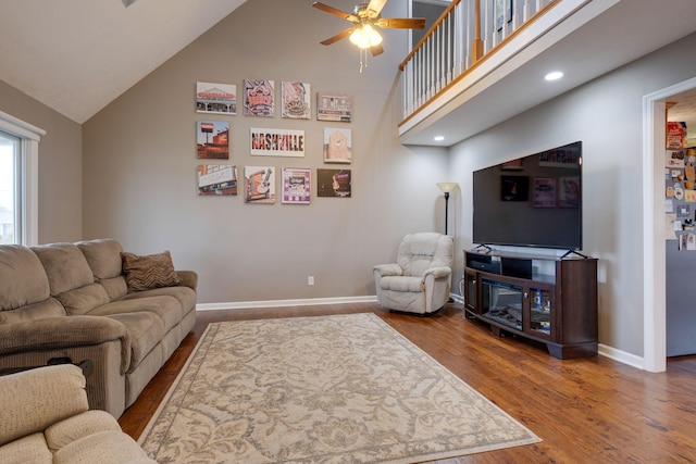 living room featuring ceiling fan, high vaulted ceiling, and hardwood / wood-style flooring