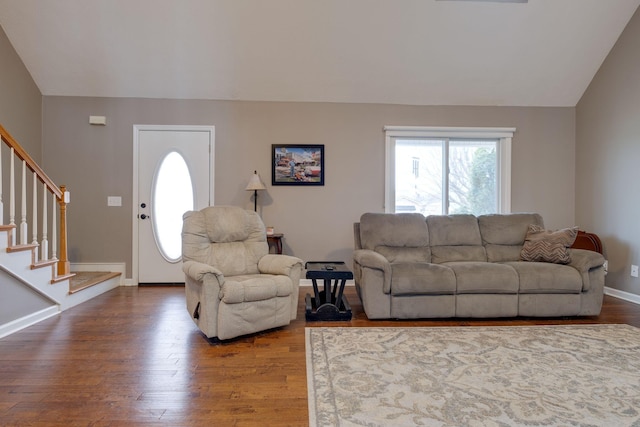 living room with wood-type flooring and vaulted ceiling