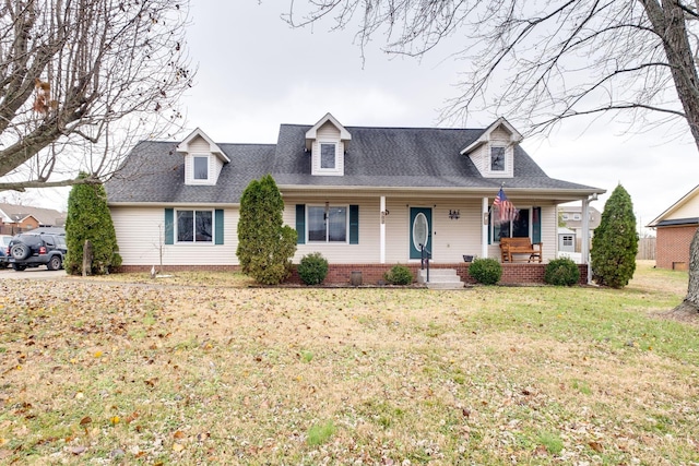 cape cod home featuring a front yard and a porch