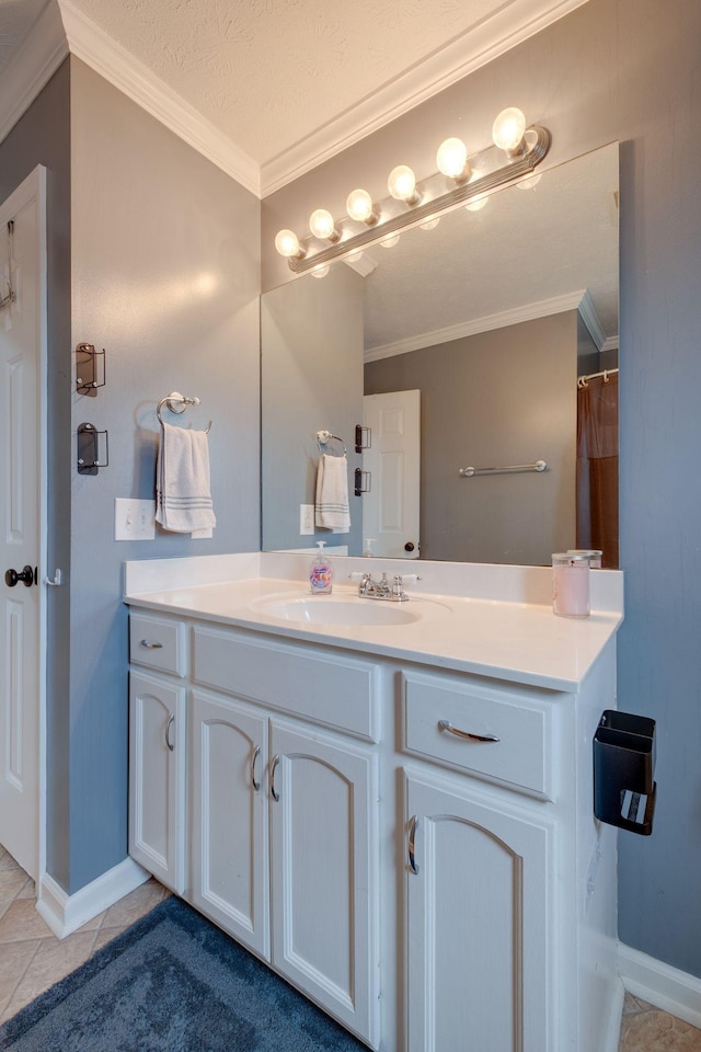 bathroom with tile patterned flooring, a textured ceiling, vanity, and crown molding