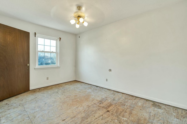 spare room with ceiling fan