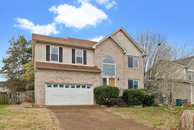 front of property featuring a garage and a front lawn