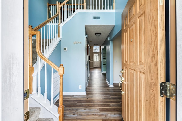 foyer entrance with dark wood-type flooring