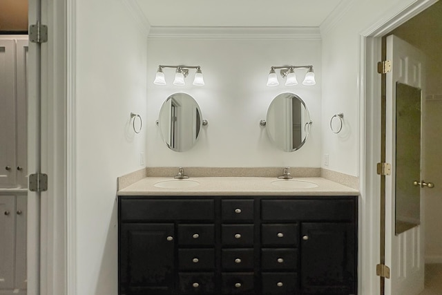 bathroom featuring ornamental molding and vanity