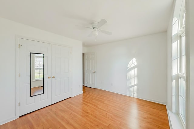 unfurnished room featuring ceiling fan and light wood-type flooring