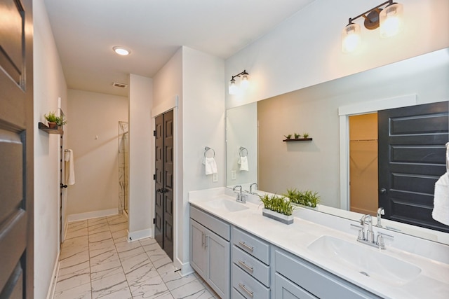 bathroom with a shower and vanity