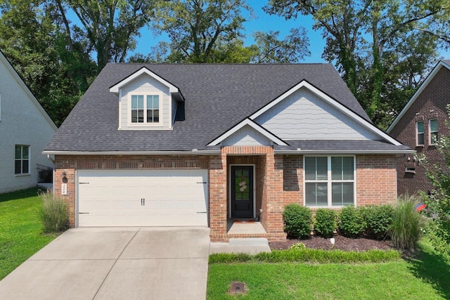 view of front facade with a garage and a front lawn