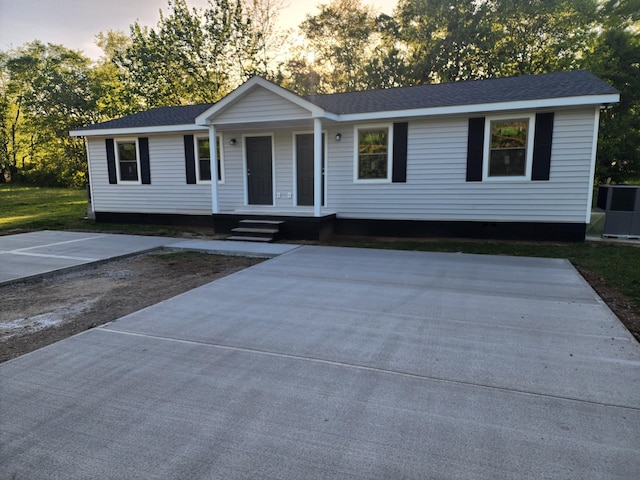 view of front of home featuring covered porch and central air condition unit