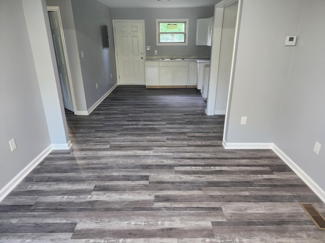 hallway featuring dark hardwood / wood-style flooring