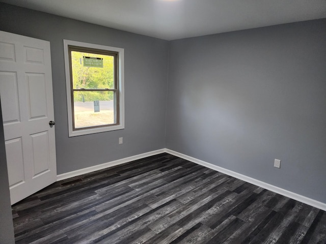 empty room featuring dark hardwood / wood-style floors