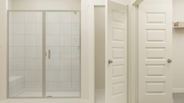 bathroom featuring an enclosed shower