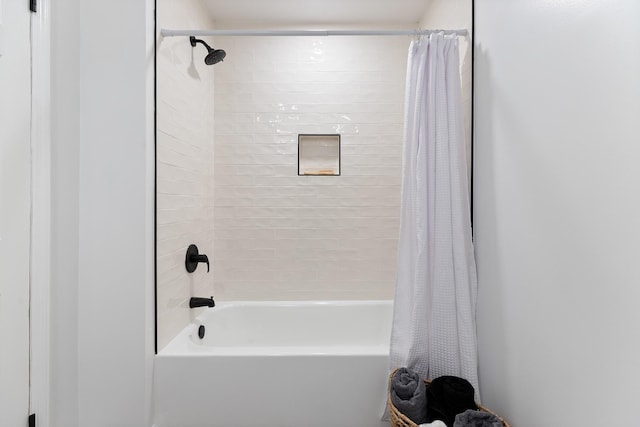 bathroom featuring shower / bathtub combination with curtain