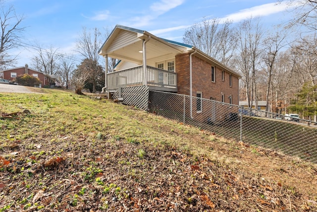 view of home's exterior featuring a yard