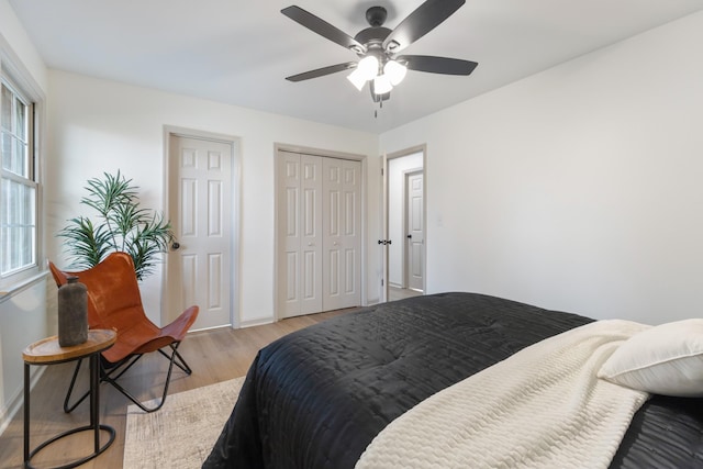 bedroom featuring ceiling fan and light hardwood / wood-style flooring