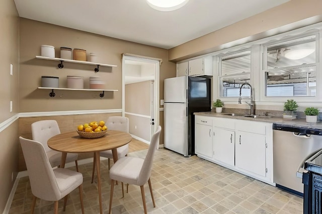 kitchen featuring white cabinets, sink, and stainless steel appliances