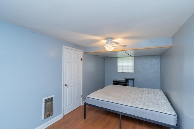 bedroom featuring ceiling fan and hardwood / wood-style floors