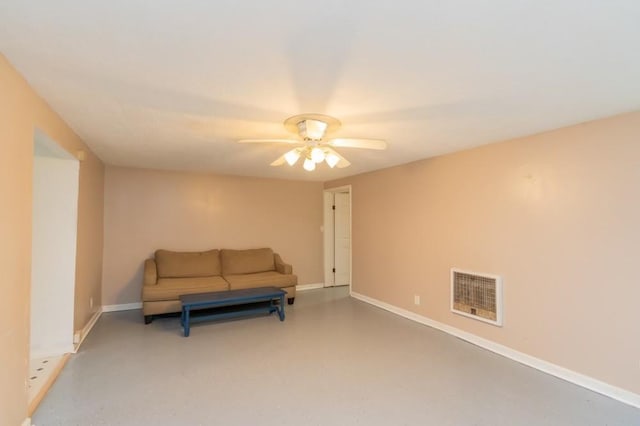 living area featuring concrete floors and ceiling fan