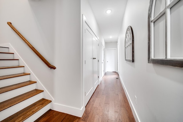 corridor with wood-type flooring